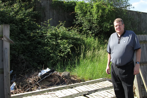 Cllr Tim Hill, broken fence panel