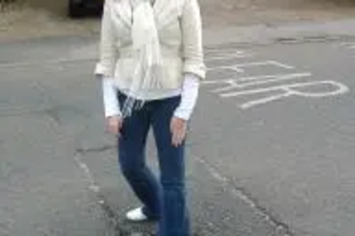 Nina at the pothole in Woodman Road