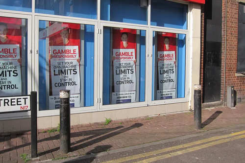 Bookmakers' frontage with responsible gambling posters