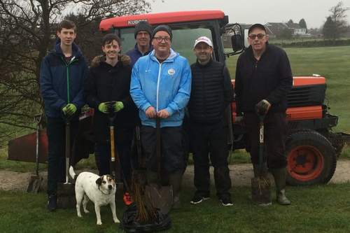 Councillor Kelly and the group planting the trees