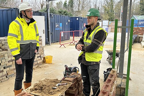 Ian talking to someone at the National House Building Council Training Hub in Impington