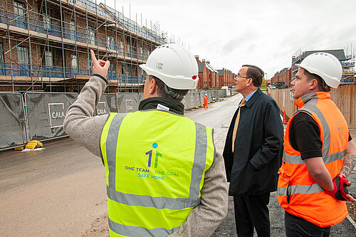 Martin Tod looks at new council homes under construction with two of the people building them