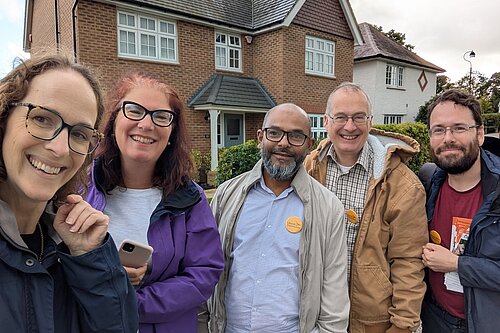 Alison and Canvassers on the street in Haywards heath infront of a house