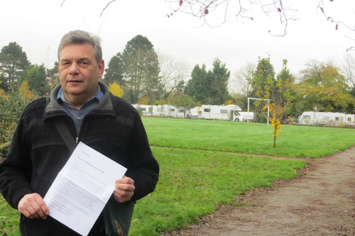 Travellers occupy Whinfield Recreation Ground - Cllr Neil Sandison in the foreground