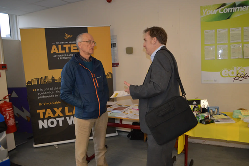 Vice Chair Tony Vickers (left) talks to a delegate