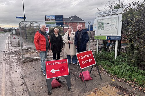 Liberal Democrat councillors stood outside the Barratt site 