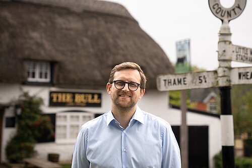 Freddie standing in front of the Bull pub