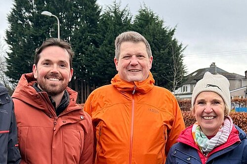 Adam Harley, Ben Langmead and Susan Murray smiling in Bearsden.