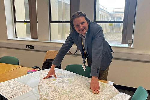 Steff looking at map of walking routes