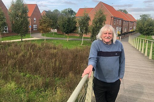 Cllr Tony Fisher on a pedestrian bridge