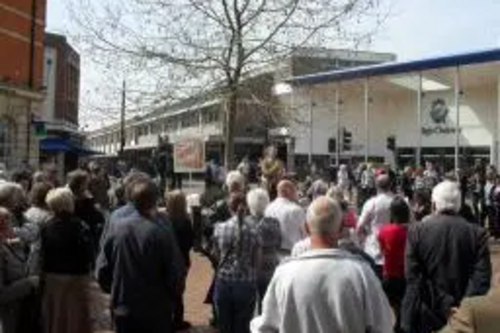 Crowd of people in High Street, Chelmsford with Stephen Robinson speaking