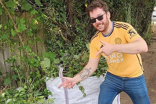 Alex Lock pointing at cleaned up mess