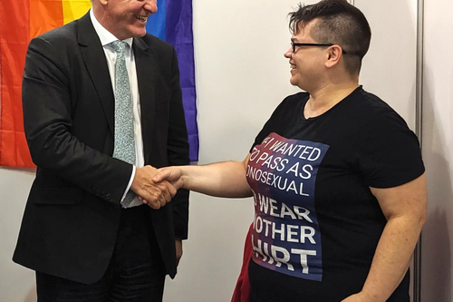 Dr Phillip Lee MP, and Holly Matthies of the LGBT+ Lib Dems executive, at the LGBT+ Lib Dems stall, Bournemouth Conference 2019