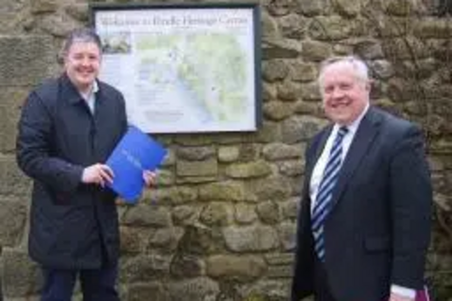 Councillor Dale Mulgrew alongside John Miller – Chief Executive of the Heritage Trust for the North West – outside the Pendle Heritage Centre