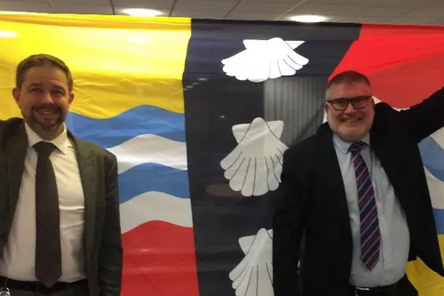 Mayor Dave Hodgson and Councillor Jon Abbott with the Bedfordshire Flag