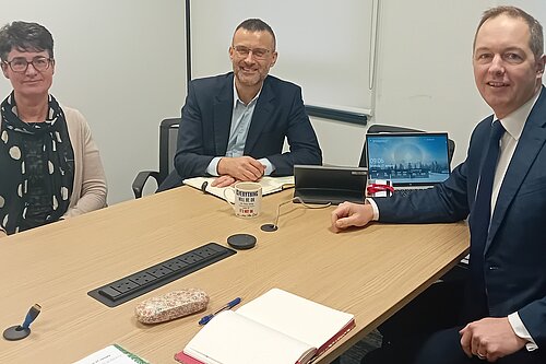 Richard Foord (right) sat at a table with Steve Moore (centre) and Kirsty Denwood (left) of NHS Devon