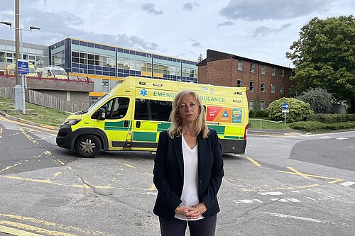 Liz Jarvis MP stood in front of an ambulance 