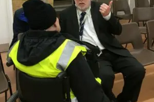 org.uk/files/2018/02/Paul-speaking-with-wheelchair-resident-Small-300x291.jpg
