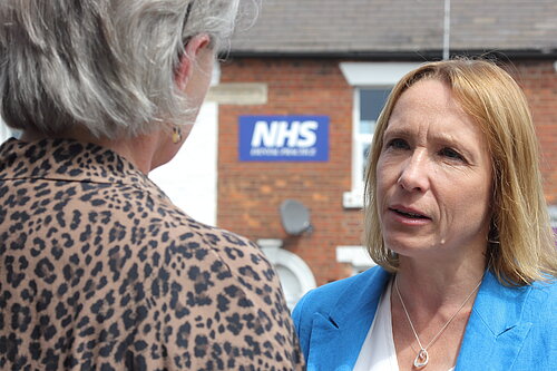 Photo of Helen Morgan outside an NHS building