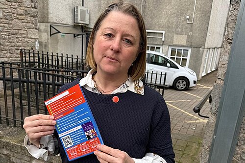 Libby wearing orange button