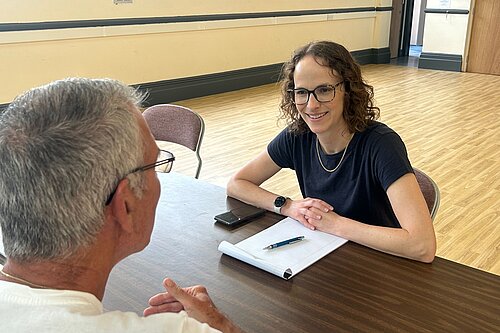 Alison speaking to a constituent 
