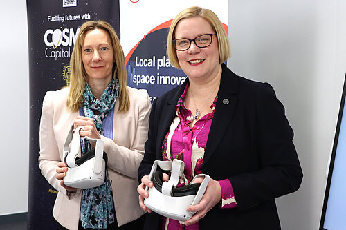 Caroline Fleming, Director of Surrey Innovation District at the University of Surrey, and Guildford’s MP Zöe Franklin showcase VR headsets