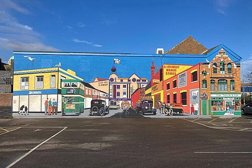 Historic Grimsby street-scene mural in East Marsh, featuring the Burson shop, buses, marine stores, local businesses and the dock tower.