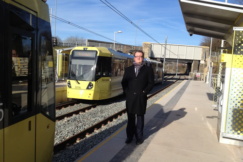 Cllr Andy Kelly with the new trams