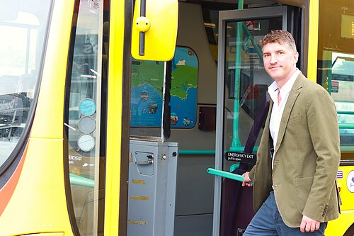 Edward Morello MP getting on a bus