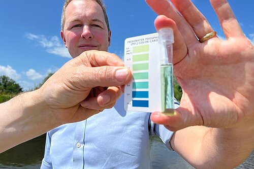 Richard Foord holding a water quality tester