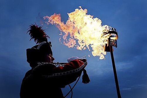 image of bugler with lit beacon