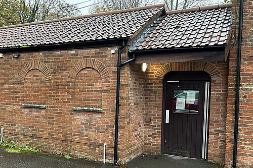 The JHoots pharmacy in Wellington with MP Gideon Amos, inset