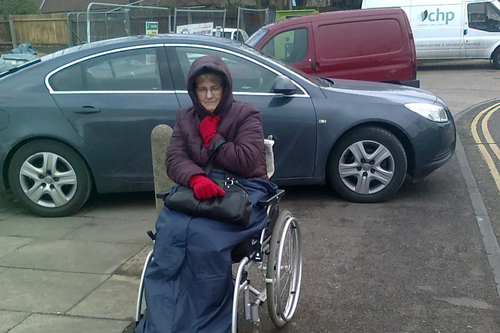 lady in wheelchair cannot get past cars blocking the path