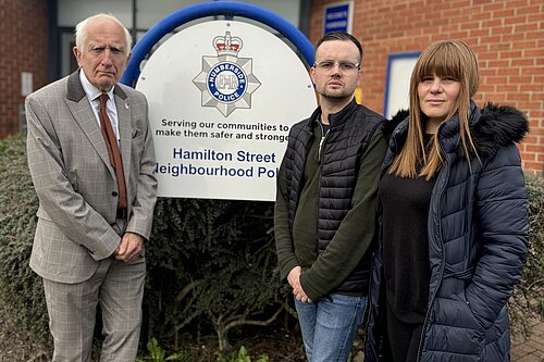 Three Liberal Democrat councillors standing outside Hamilton Street Neighbourhood Police Station in Grimsby.