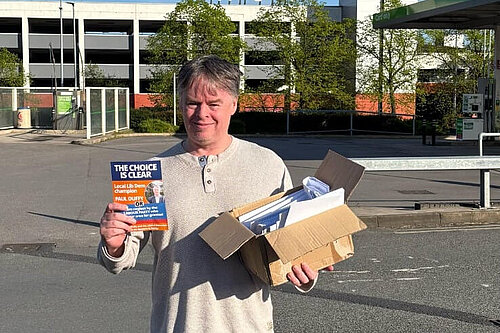 Paul Duffy carrying leaflets
