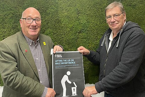 Cllrs Robin Bradburn and Paul Trendall with 'Boys NEED Bins' poster