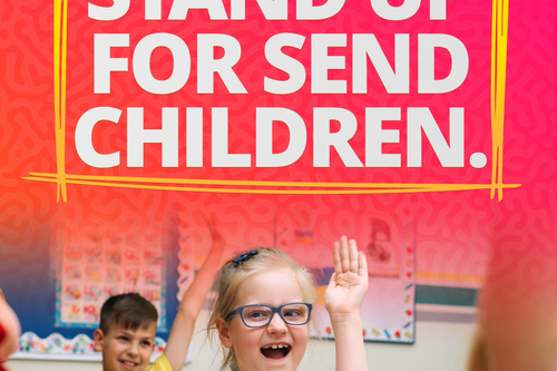 a child with her hand up and the words Stand Up for SEND Children