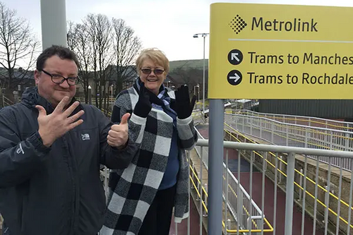 Councillor Andy Kelly and Irene Davidson at Newhey Metrolink Station