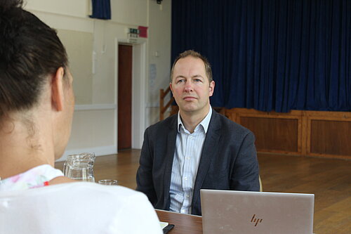 Richard Foord MP talking during surgery 