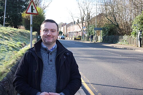 James Kenyon standing next to a street.