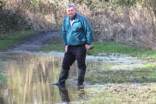 Cllr Neil Sandison standing in a puddle in Great Central Way 6 March 2015