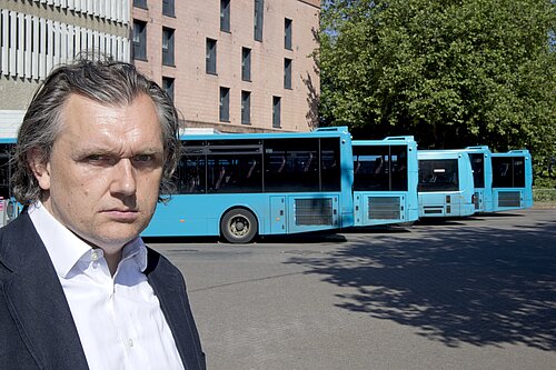 Councillor Rob Wilson with local buses