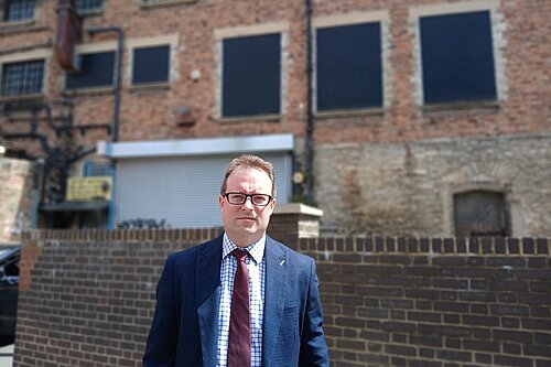 Henry Vann outside the back of Debenhams