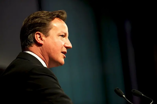 Cameron speaking at a conference,