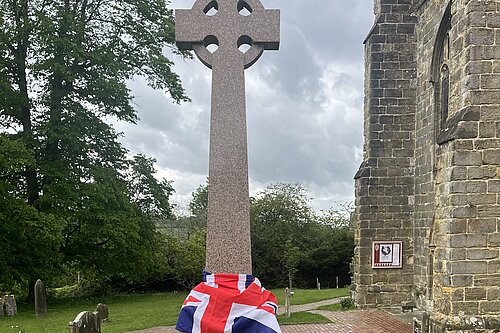 Battle War Memorial draped in the Union Jack Flag for VE Day