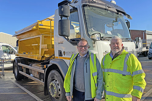 Councillors Henry Vann and Charles Royden standing in front of a gritter lorry