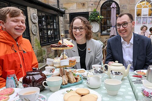 Alison Bennett MP and Tom Gordon MP in front of afternoon tea talking to Young carers