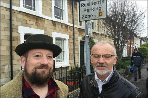 Councillors Toby Robson and Stan Pajak standing next to a Residents Parking Sign in Swindon