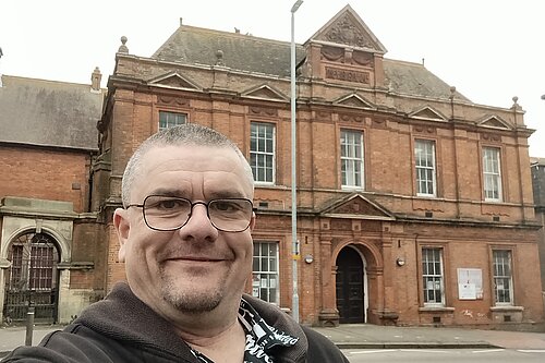 Tim Prater outside Grace Hill Library and Museum building, Folkestone