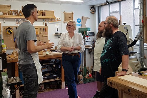 Zoe talking to voters in young persons skill development area